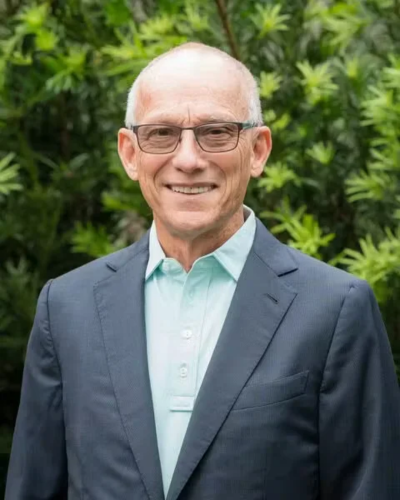 Joe Pryor, Chief Executive Officer of VRET, wearing a suit and smiling professionally